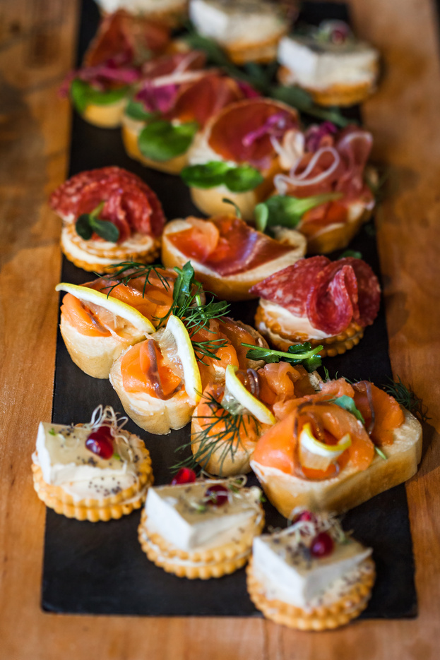 Sandwiches with Cheese, Fish, Salami, Herbs and Lemon. Selective Focus