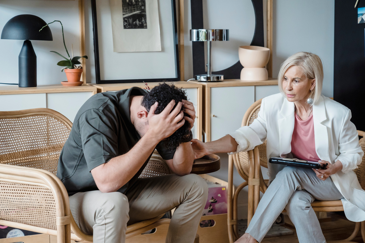 A Woman Talking the Depressed Man