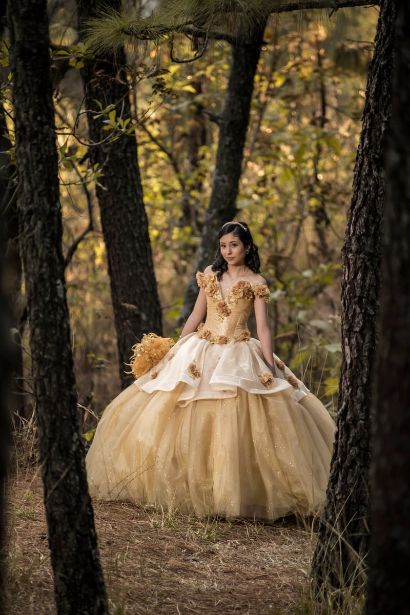 Female Teenager Wearing Her Yellow Ball Gown in the Forest
