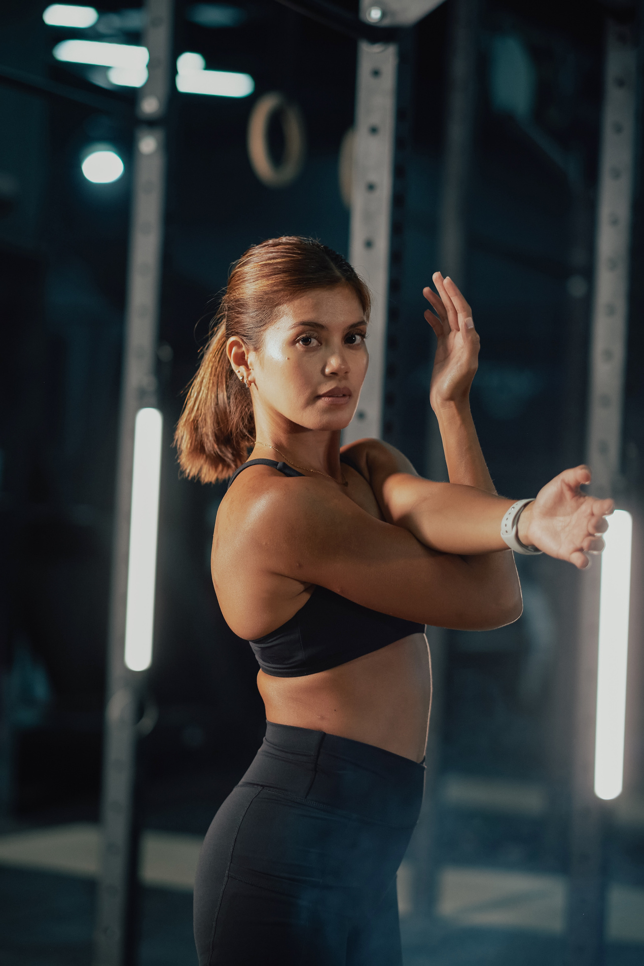 Female Trainers and Weightlifting Woman Stretching in a Gym