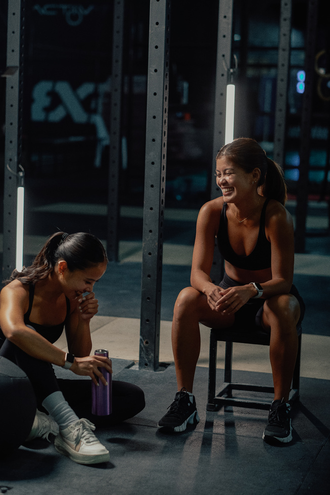 Female Trainers and Weightlifting Women in a Gym