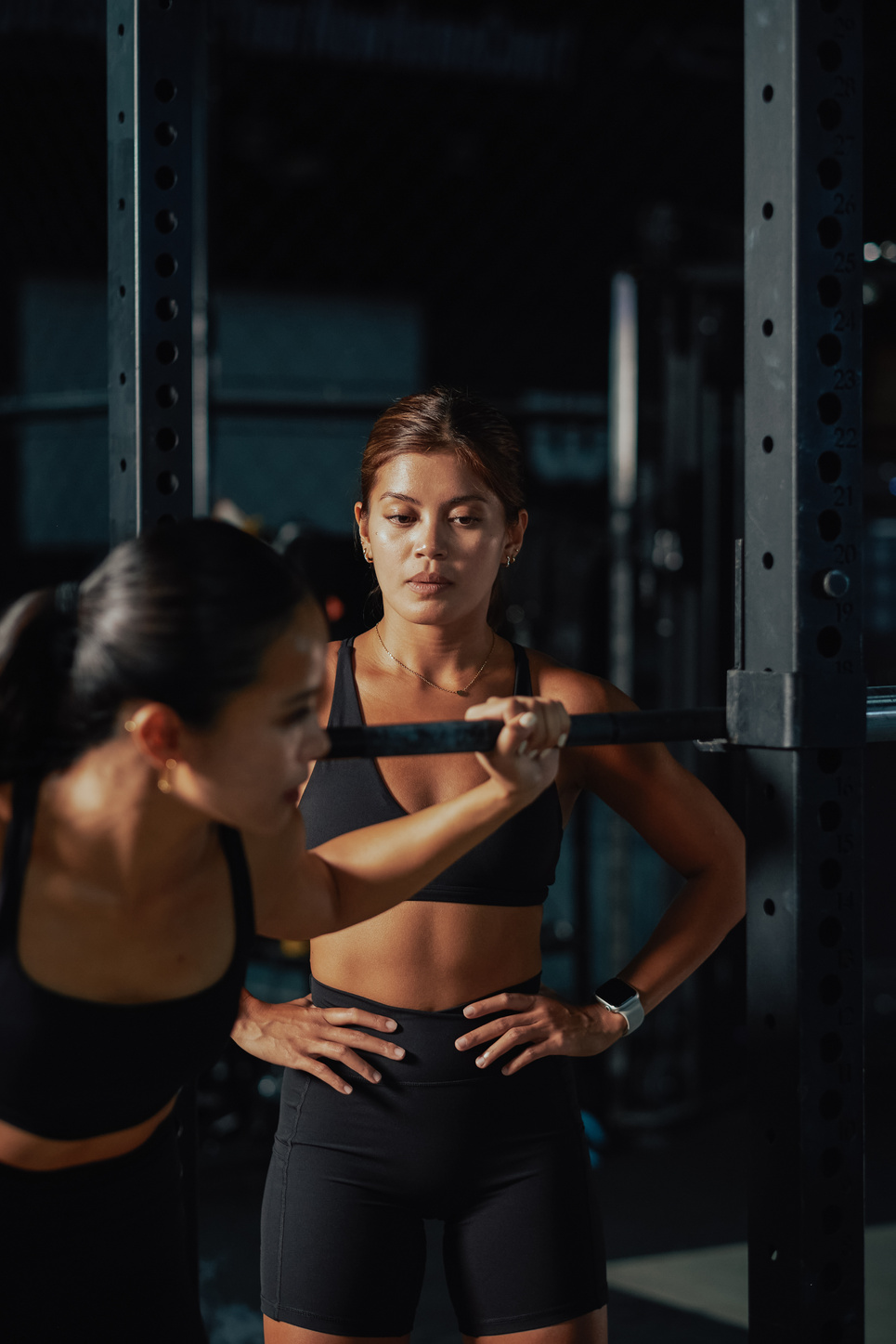 Female Trainers and Weightlifting Women Training in a Gym