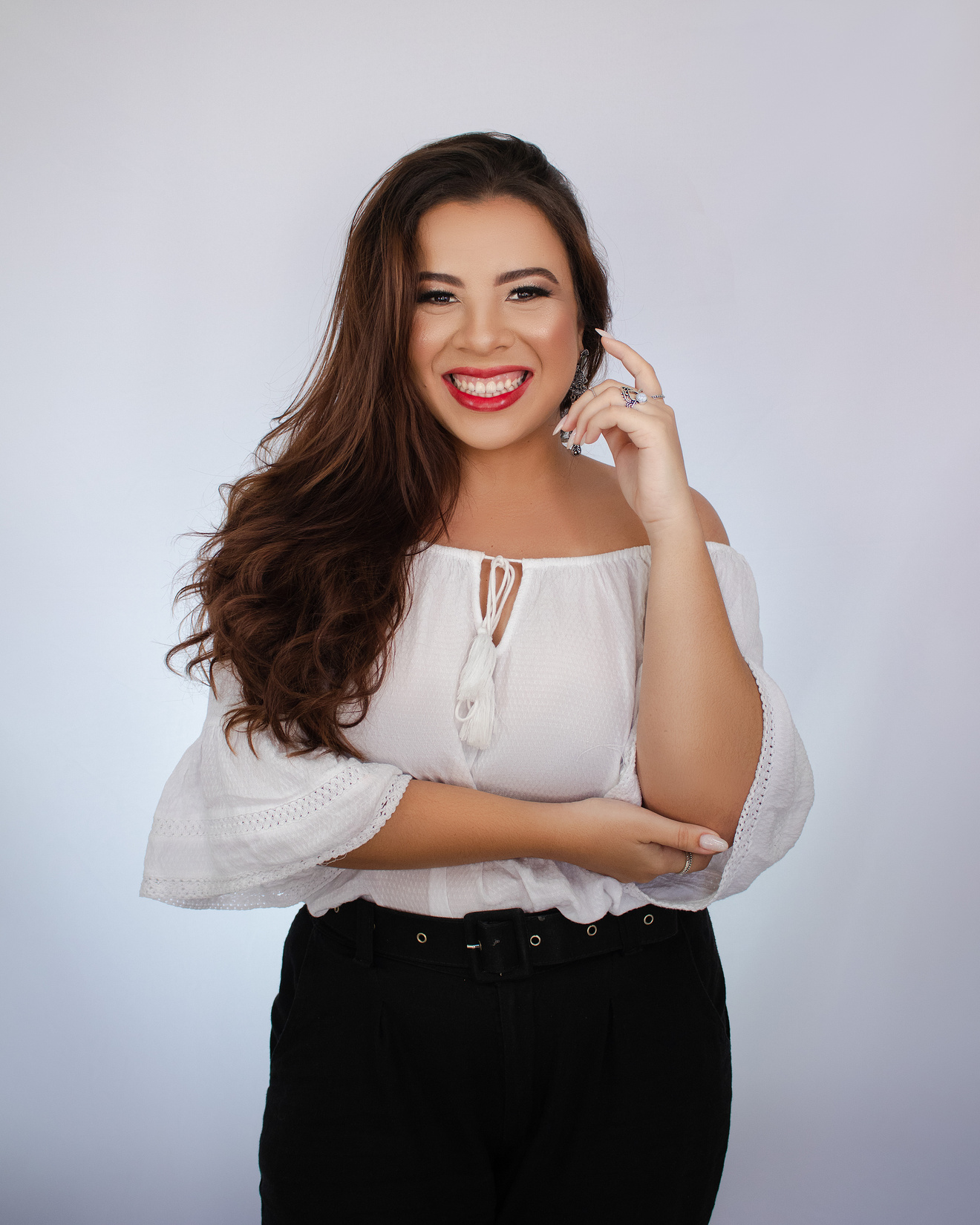 A Woman in White Off Shoulder Top Smiling