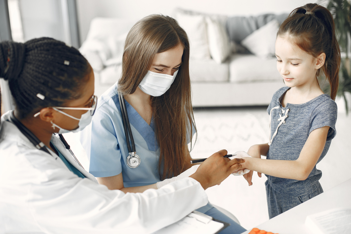 Little Girl at a Medical Checkup at Home 