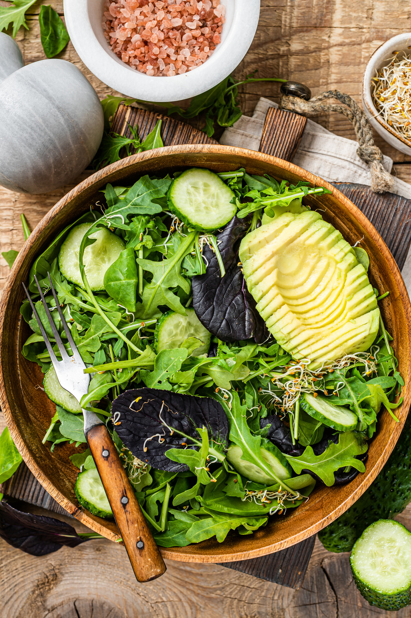 Green Vegan Salad with Green Leaves Mix, Avocado and Vegetables.