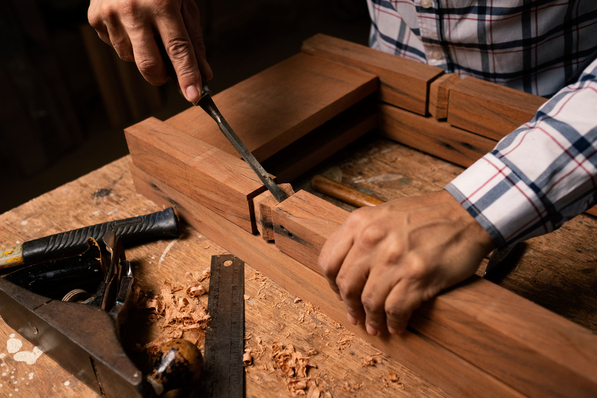 A Person using a Chisel