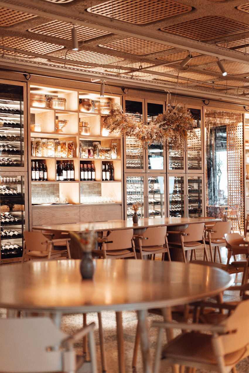 Interior of stylish restaurant with wine wall