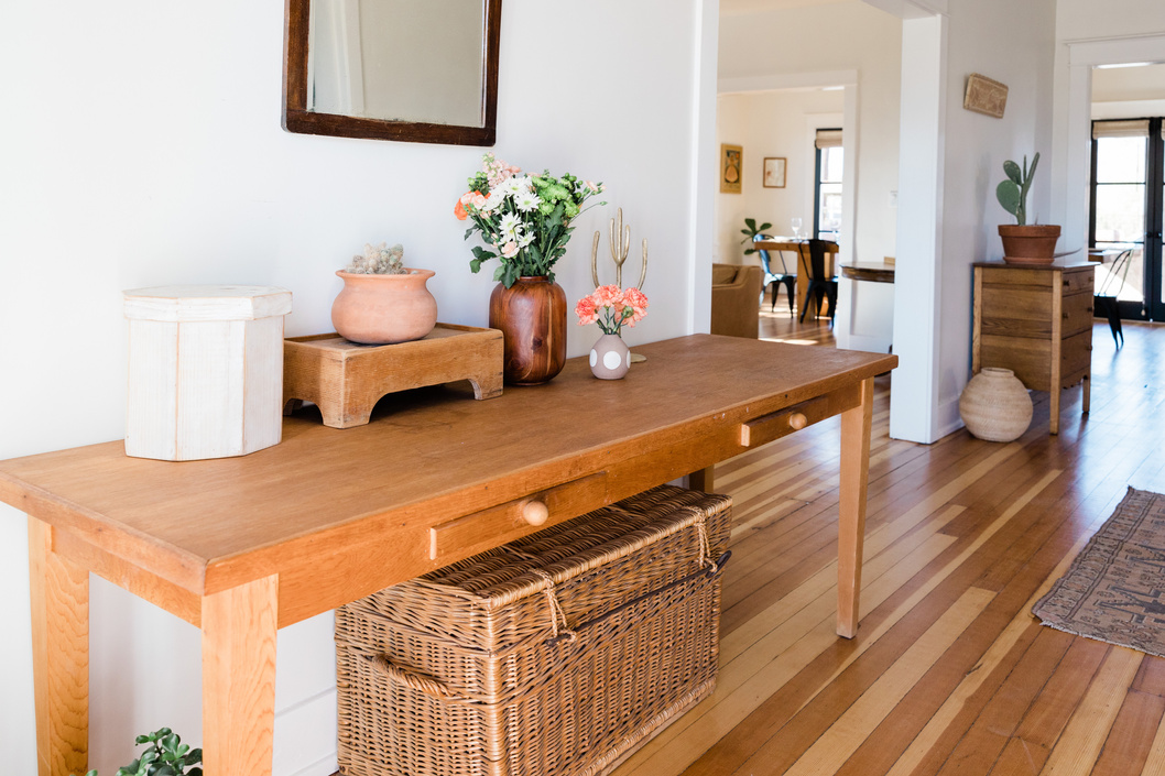 Wooden Furniture and Wicker Trunk under the Table